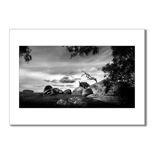 Dramatic black and white landscape art print of weathered boulders in the Barossa Valley, Australia. Showcasing the interplay of light and shadow