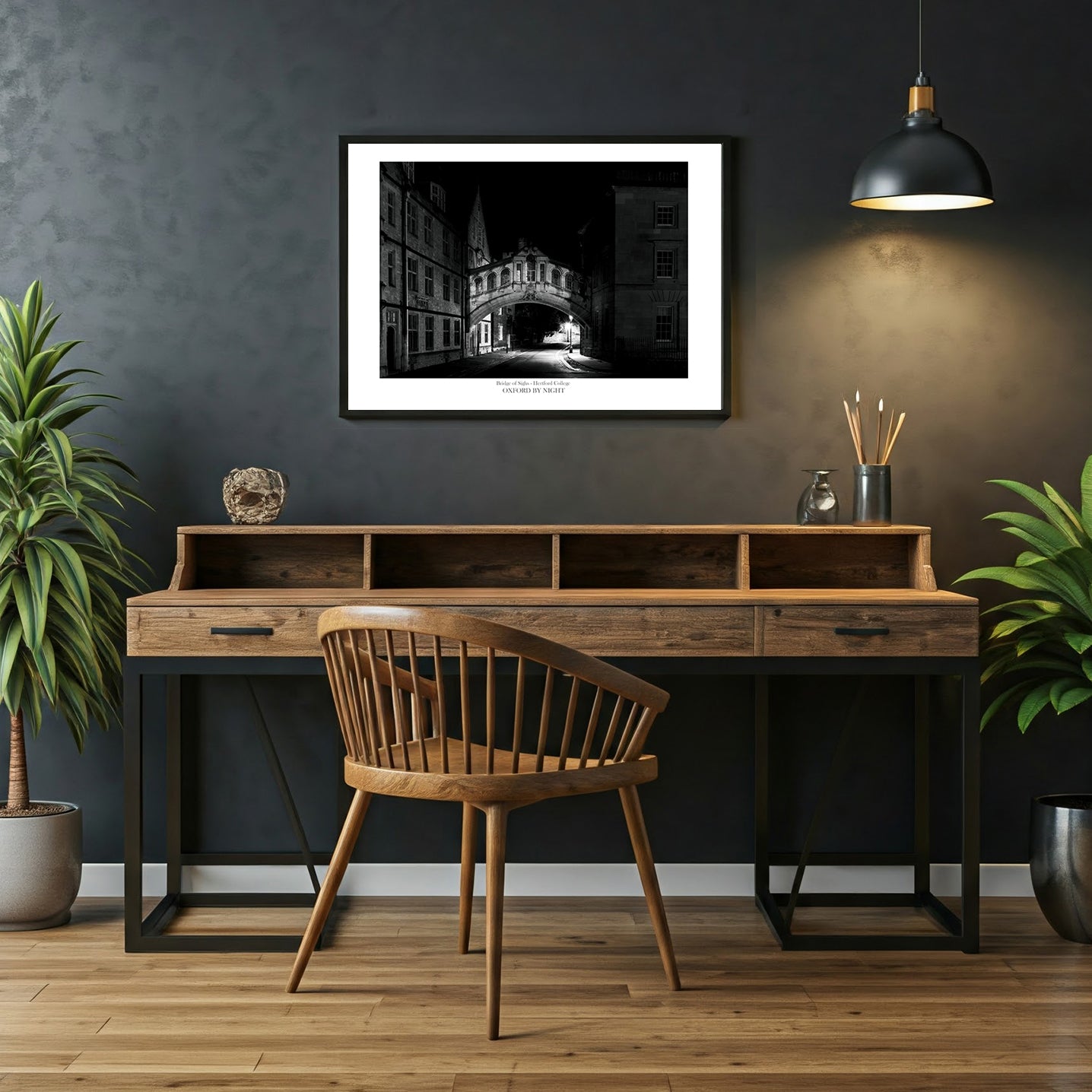 A dramatic night time photographic wall art print of the Bridge of Sighs, Oxford. The black and white image showcases the intricate architecture of the bridge and highlights the play of light and shadow