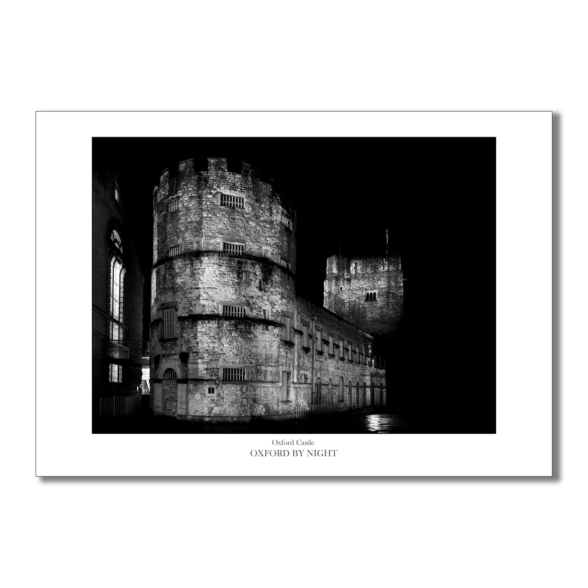 Evocative B&W art print showcasing the architecture of  Oxford Castle under the cover of darkness. A mesmerizing black and white image highlighting the architectural details of this historic building.