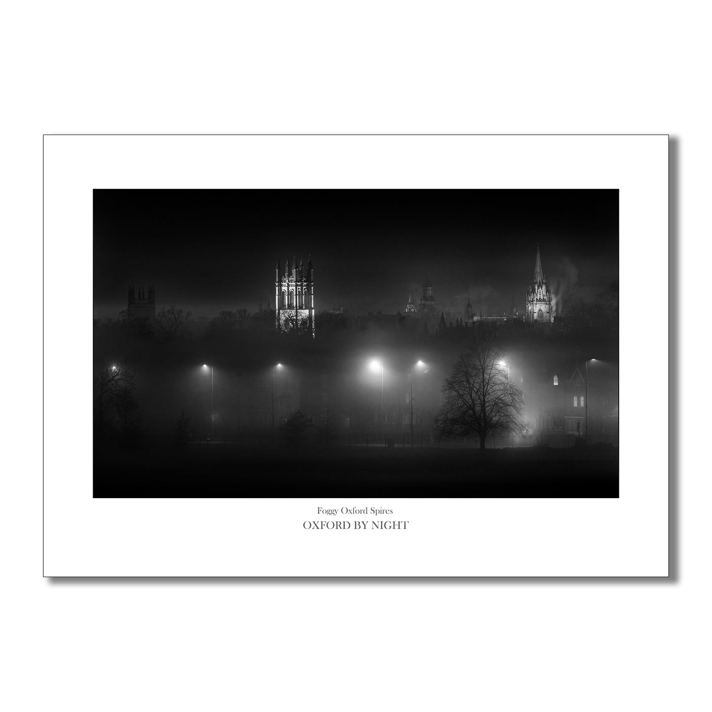 Evocative and mysterious B&W art print capturing the floodlit spires of Oxford under the cover of darkness. 