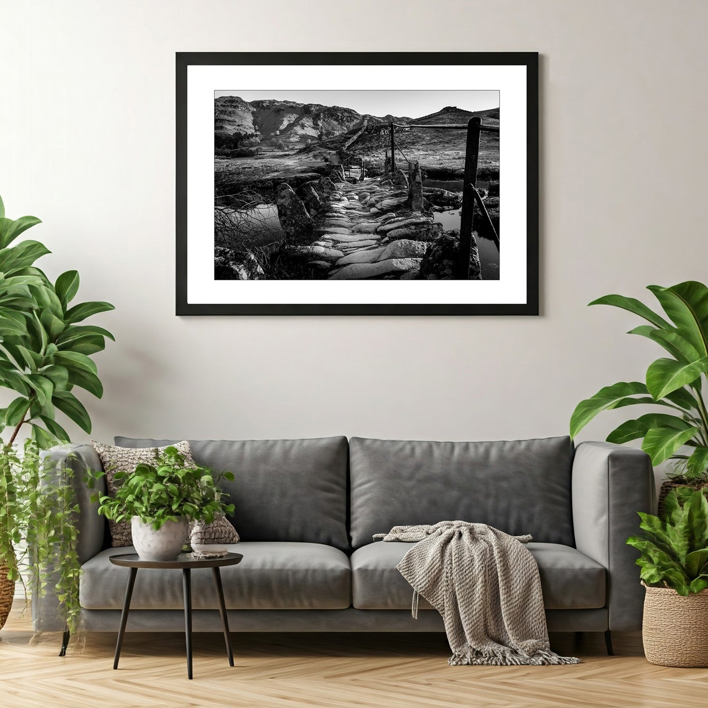 Experience the tactile beauty of the Lake District with this stunning black and white wall art print of Slaters Bridge. Feel the texture of the cobbles beneath your feet and the serenity of the flowing stream.