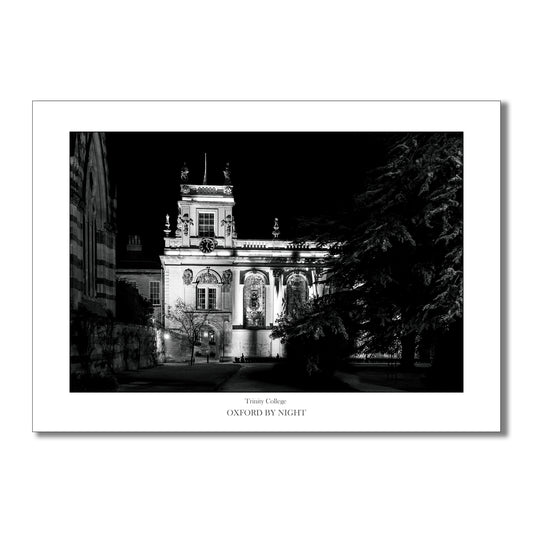 Evocative B&W art print showcasing the floodlit architecture of Trinity College Oxford under the cover of darkness. A mesmerizing black and white image highlighting the architectural details of this historic college.